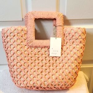 a. new day medium pink straw tote. NWT